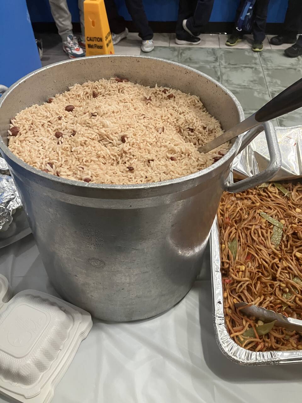 Large pot of rice and beans prepared for the shelter feeding line